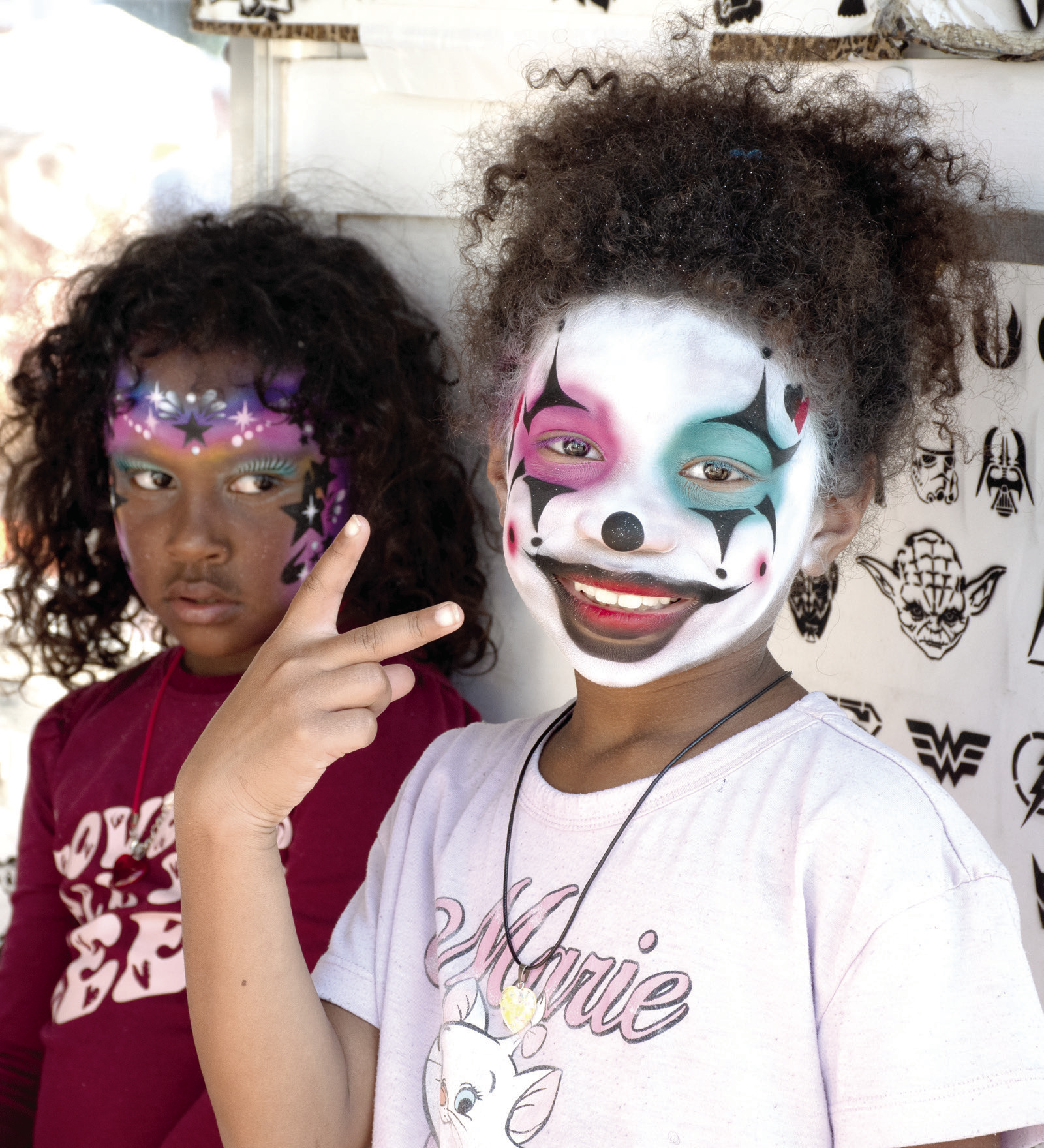 Liliana McCray of Columbus and Nylah Fermin of Joplin, Mo. were two of many youngsters who got their face painted during the Annual Columbus Day Festival art and craft show October 10.