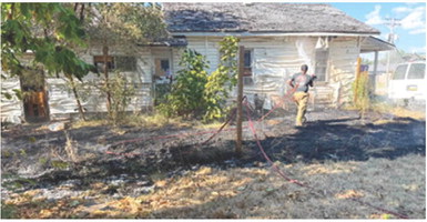 After a grass fire got out of hand due to the extremely hot and dry conditions it caused serious damage to the outside of a residence in Columbus. A burn ban was issued by the City of Columbus Thursday. Photo courtesy of Columbus Fire Department.
