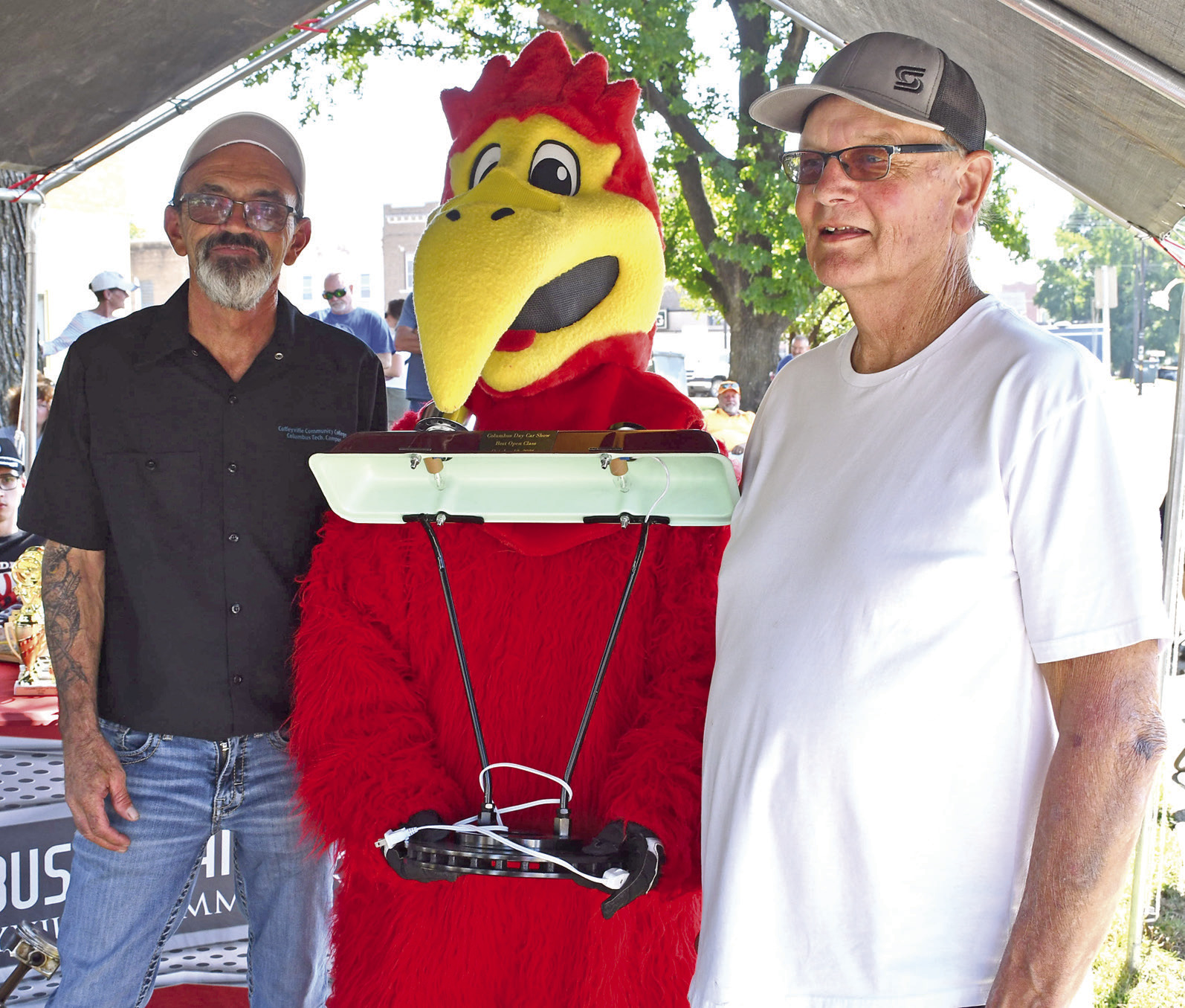 The Annual Columbus Days Car Show saw new faces and prizes this year as the event was hosted by Coffeyville Community College and Sally Davis Real Estate. Jason Spainhower and the Coffeyville Raven present the Top award in the “Other” Category went to Dave Baker with his 1942 B. This lamp made from various car parts was designed and built by Automotive Collision instructor and Columbus resident Hal Daniels.