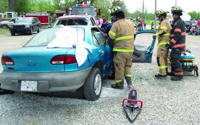 In the beginning Columbus fire fighters survey the extent of the accident and the condition of the vehicle occupants. They used their extrication equipment to get the students out.