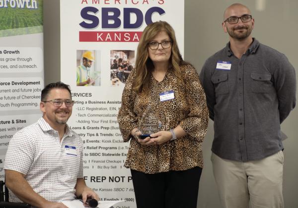 CCEDC Chairman Brian Smith, Left, and Vice-Chairman Jake Letner, right, presented the Business Growth award to Darryl’s Auto Service in Baxter Springs. Receiving the award on behalf of the business is Cheryl Jones.
