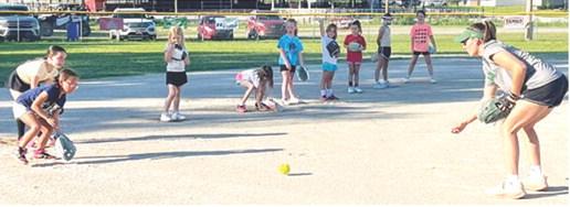 Young softball players learn skills