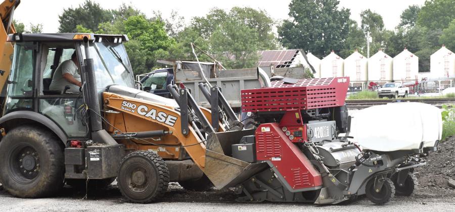 City of Columbus crews have been working to grind streets ahead of planned resurfacing later this fall. The new milling machine, shown attached to one of the city’s backhoes, has experienced issues in recent weeks resulting in its temporary retirement. City Superintendent Randy Coble expects it to be back to work in the coming weeks.