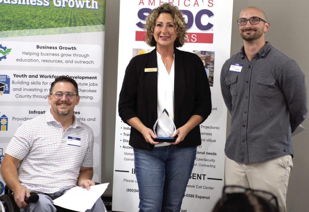 Plaques were presented during the annual recognition breakfast held by the Cherokee County Economic Development Corporation October 7. Above, Sally Davis of Davis Real Estate was presented the Hall of Fame Award at this year’s breakfast. Below, Patti Street accepted the Community Impact award on behalf of Dream Big Little One. Both awardees are based in Columbus. Brian Smith and Jake Letner presented the plaques.