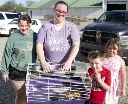 Chick Day at Columbus Farmer’s Coop drew a large interest in buying baby chicks. With their purchases Ema Reynolds, Angela Aldrighetti, Donny and Ellis Reynolds. There were 12 different breeds of chicks available.