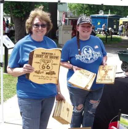Plaques for the Car Show Winners were distributed Saturday. The unique burned wood plaques were popular among the drivers. Chamber Board Members Jessica Moore and Debbie Hopkins were preparing the plaques for presentation.