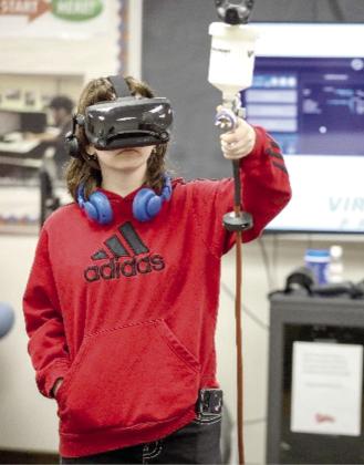 An area high school student testing out the new Virtual-Paint VR training system during Tech Days this past semester. Courtesy photo.
