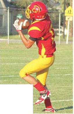 Freshman, Hayden Kellogg, pulled down a pass from freshman QB, Blaze Bowman and ran for one of his two receiving touchdowns in the 28-18 win over Galena, Monday, at Titan Stadium.