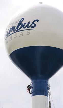 Workmen were finishing the work on the water tower in Columbus City Park. The iconic ships have been replaced with the city’s official logo. The decision for the change was made at the April 6 Columbus City Council meeting.