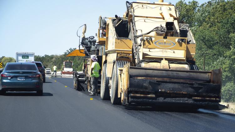 Fresh blacktop was being laid on the eastern two miles of Old US Highway 96 this week. By Thursday at noon, contractor Bettis Asphalt had the entire east bound lane, and more than one-third of the west bound lane completed. Drivers are encouraged to use caution in the area while crews work to complete the project ahead of the Labor Day weekend.
