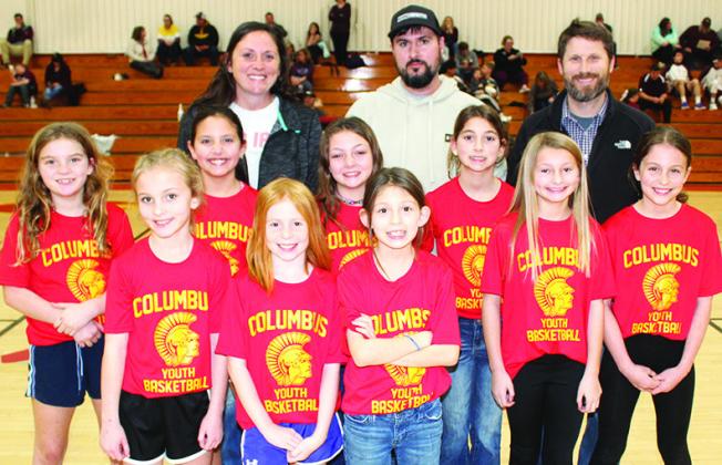 (Right) The Lady Titan Fourth Grade Columbus Rec Team was introduced during the Varsity halftime of the Lady Titans game against St. Paul in January. Team members are back row: Lindy Smiley, Morgan Anderson, Tannor Harris, Izzy Crain, Paizley Buergin, and Kinzley Hess. Front row: Cali Rogers, Karrah Croizer, and Angelina Capron. Coaches for the team are: Devon Anderson, Bryce Buergin, and Dan Walters