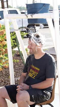 One of many games for students to participate in at the annual Back-To-School Carnival hosted by Columbus USD 493 Thursday, August 27 was the ‘Dunk Tank’ sponsored by Coffeyville Community College. Park Elementary Principal Matthew Crain was all smiles just before this torrent of water cascaded onto his head.