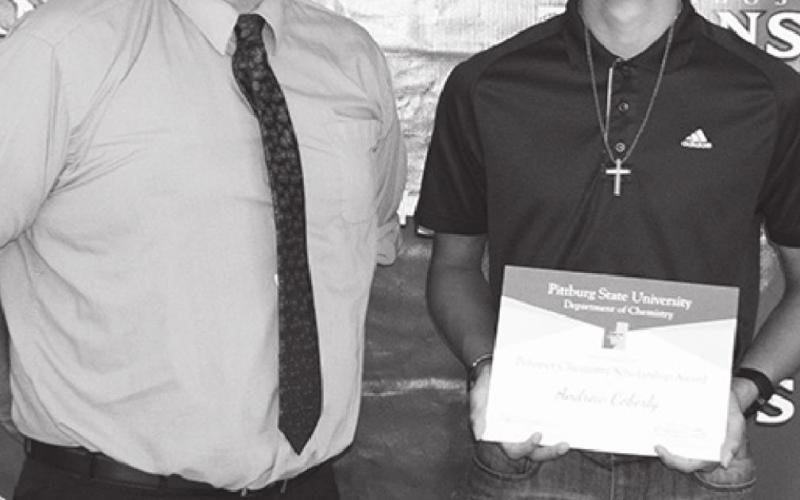 Buddy Derfelt, CUHS Science Instructor, presented a $500 PSU Polymer Chemistry Award to Andrew Coberley.