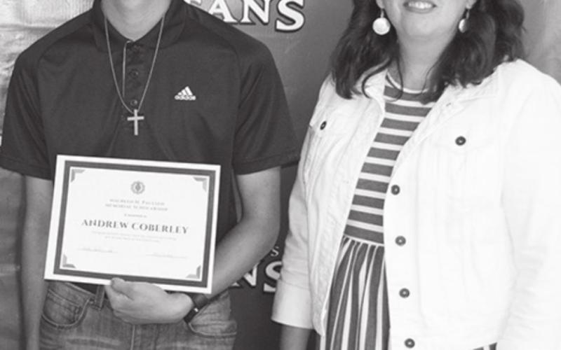 Jennifer Thompson presented the $300 Maureen Paulsen Columbus Community Foundation Scholarship to Andrew Coberley.