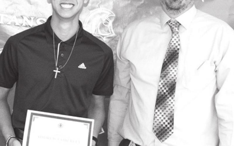 CUHS Principal, Dan Grundy presented the $1,000 Tom Goettel Scholarship to Andrew Coberley.