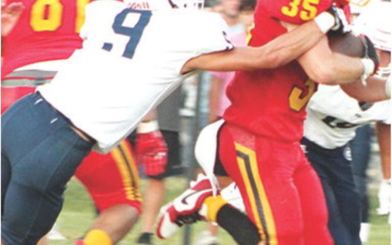Senior, Syler Schuberger, broke multiple tackles on this big gain including an attempt by Galena Junior, Chase Cottrell. Syler rushed for 87 yards and a touchdown on 12 carries in the 28-8, Titan win over the Bulldogs, Friday in Columbus. Senior, Rece Ponce helped provided the gap for Schuberger’s run.