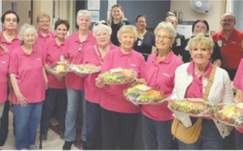 Members of Columbus’ Mercy Auxiliary delivered fruit trays and cookies to staff at the Columbus hospital. The group was celebrating Hospital Appreciation Month. Courtesy photo.