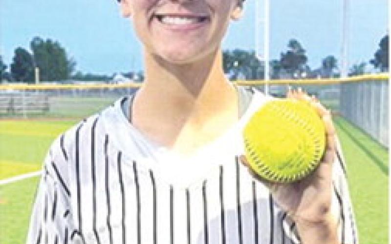 Katy Mooney, Lady Titan Senior, capped the shutout win for Columbus, 7-0, in game one of the double header sweep in Girard, Thursday. The homer over the centerfield fence came in the bottom of the fourth inning, ending all scoring. Courtesy photo.
