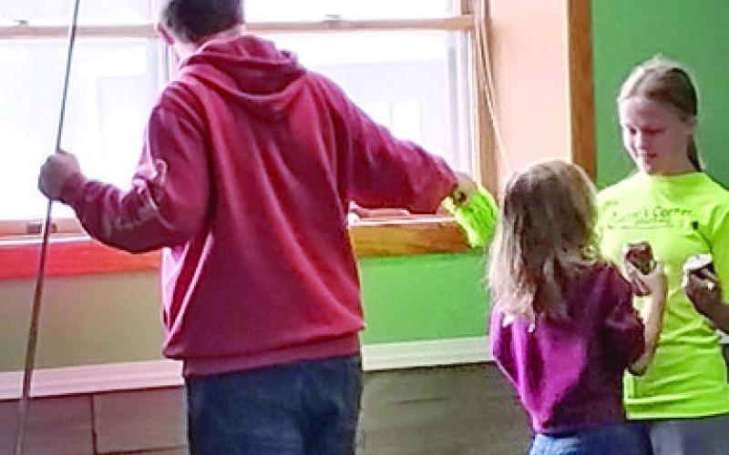 Members of the Glittering Stones 4-H Club cleaned the 4-H Building at their April meeting. Courtesy photo.