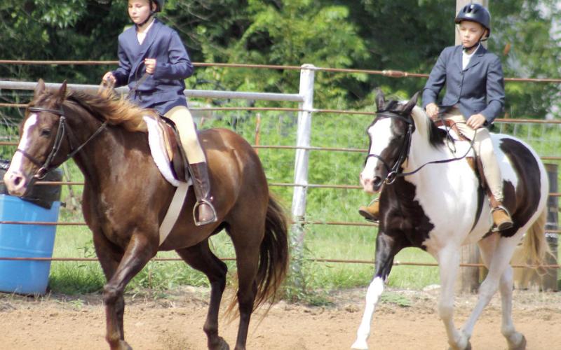 Elizabeth King and Samuel King members of Heritage Youth Association participated in the Hunt Seat Under Saddle class at the Cherokee County pre-fair horse show Saturday, July 11.