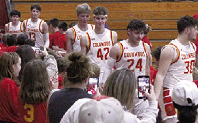 Players and parents of the Columbus Recreation Mini Basketball Teams welcomed the Titans back to the court following the introduction of the boys teams at the halftime break of the varsity game.