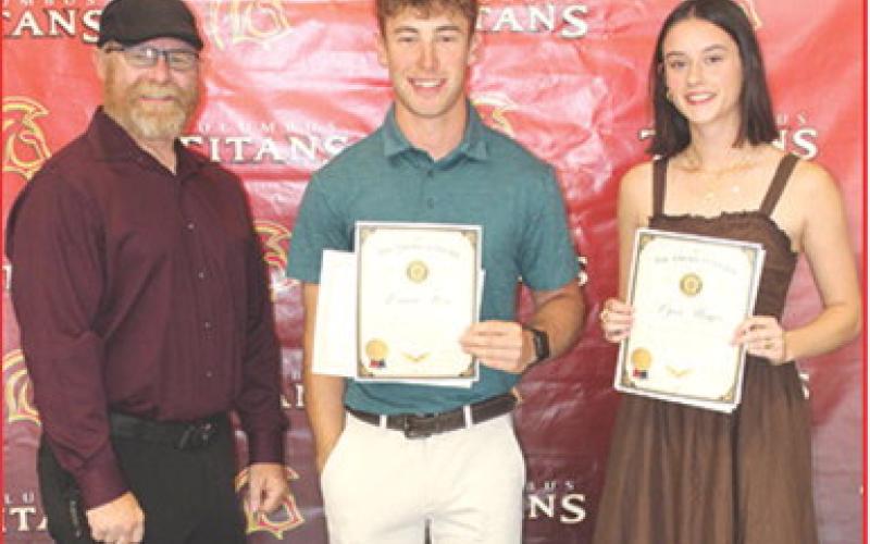 Aron Davolt presented the American Legion Awards and $150 Scholarship to Columbus Unified High School Seniors, Lemmie Stone and Piper Hayes, during the 2026 Senior Award Assembly, May 15, at the CUHS Gymnasium.