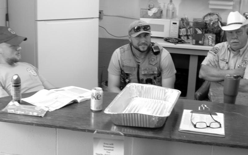 Taking a break while the students enjoy breakfast at the Hunters Safety Course, the three Conservation Officers were discussing changes in the conservation law during the recent legislative session. The officers are Austin Seoers, Colby Austin and Jim Bussone.