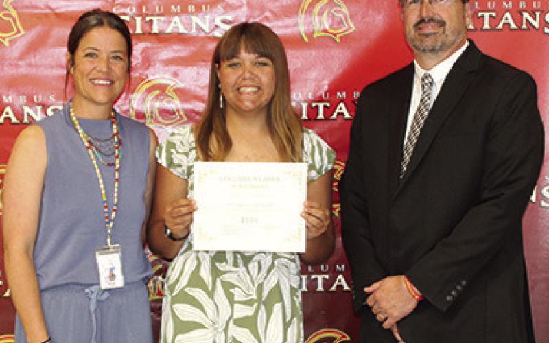 Katelyn Draeger received the $500 Class of 1986 Friendship Scholarship and the Charles and Jane Maxwell Memorial Scholarship for $750 (renewable for four years) during the May 15 Senior Assembly at the Columbus Unified High School Gymnasium. CACF Board Member, Kelly Walters and USD 493 Superintendent Dan Grundy presented the awards.