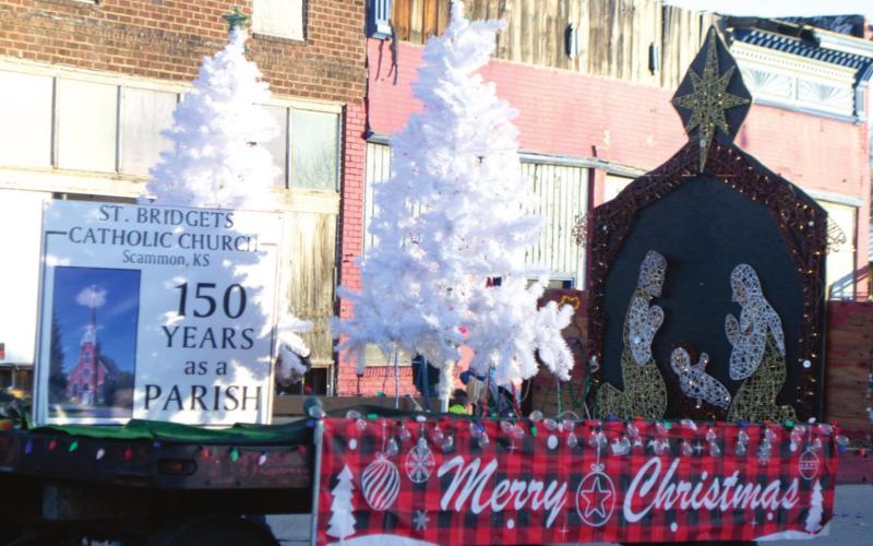 St. Bridget’s Catholic Church of Scammon drives down Main Street in the city’s Christmas parade earlier this month. The parish’s float, which celebrates their 150th year as a church, recently won first place in Columbus’ Christmas parade. Photo by Jacob Spencer.