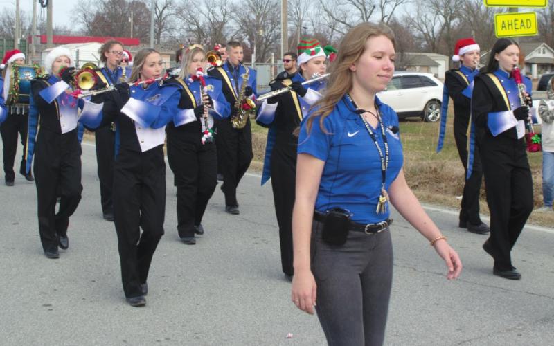 Riverton High School Band Instructor Lindsey Chambers walks ahead of her students in the city’s Christmas parade earlier this month. The school’s older students represented the district proudly with their sharp uniforms. Photo by Jacob Spencer.