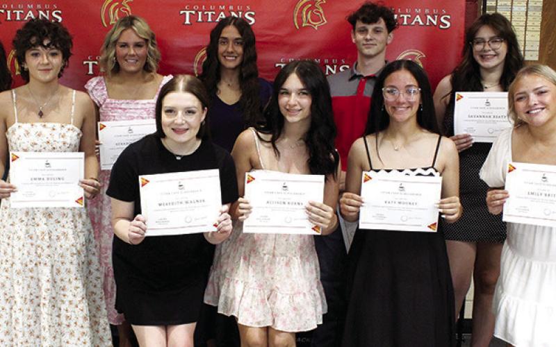Members of the Senior Class receiving Titan Cafe Scholarships are front row: Meredith Wagner, $350; Allison Burns, $650; Katy Mooney, $650; and Emily Britt, $350. Back row: presenter, Laura Boeckman, CUHS Instructor/Presenter; Emma Duling, $350; Kenadie Carter, $650; Brylie Johnson, $650; Jaiden Gannaway $650; and Savannah Beaty, $350. Scholarships were presented during the Senior Assembly, May 16, at the Columbus Unified High School Gymnasium.