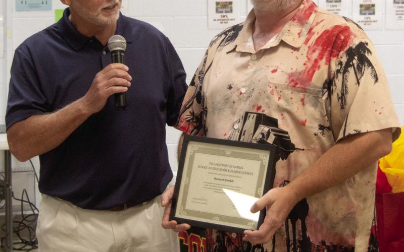 Dr. Brian Smith recognized Buddy Derfelt for 25 years of teaching.