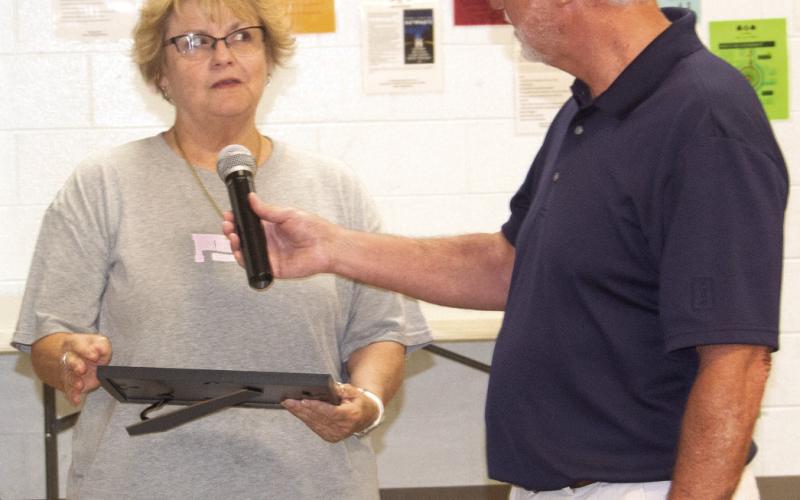 Dr. Brian Smith recognized Debra Tocci for 25 years of teaching.