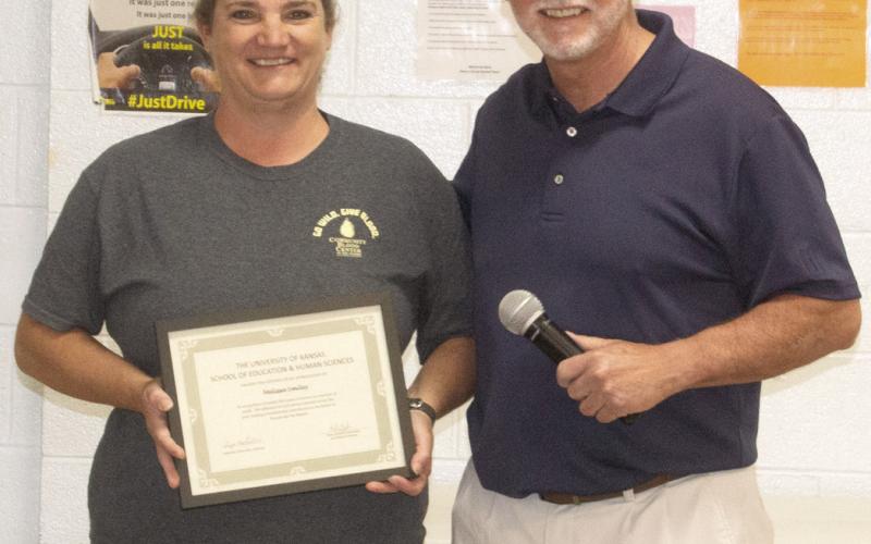 Dr. Brian Smith recognized Melissa Smiley for 25 years of teaching.
