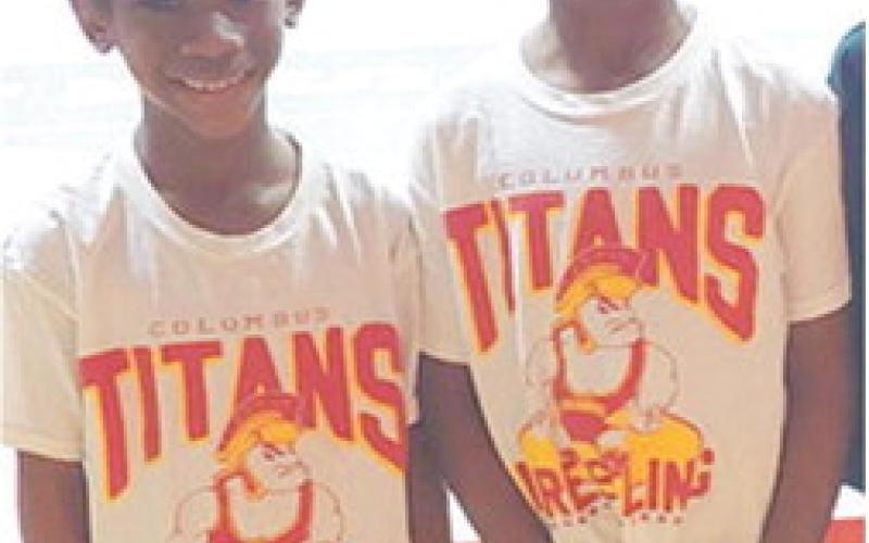 Kyra and Lyiah Lacen, members of the Columbus Wrestling Club placed sixth and fourth respectively in the Kansas Heartland Wrestling State Tournament, March 9, in Salina. Kyra and Lyiah compete in the six and under age group for the Titans. Courtesy photo.