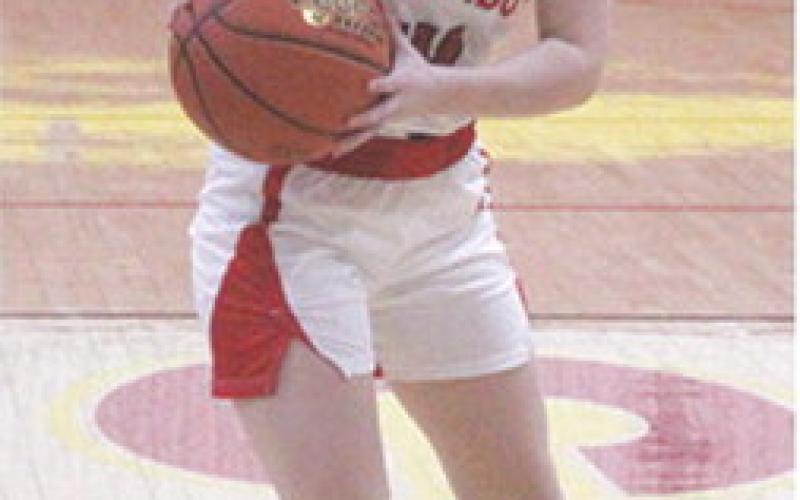 Lady Titan Sophomore, Bentley Townsend, looks to pass in the home opener vs. Colgan, December 6. Monday, Bentley’s seven points helped Columbus win the first round of the Mo-Kan Classic Tournament over Southeast, 26-22, in Cherokee.