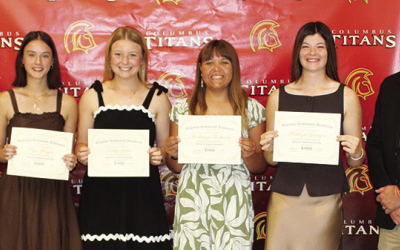 Four Columbus Unified High School Seniors received the Maureen H. Paulsen Memorial Scholarship during the 2026 Senior Assembly, May 15, at the CUHS Gymnasium. Piper Hayes, Trinity Green, Mackenzie Richards, and Katelyn Draeger each received a $1,000 scholarship from CACF Board Member, Kelly Walters and USD 493 Superintendent Dan Grundy.
