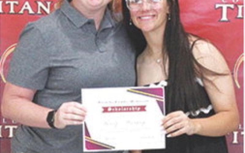 Katy Mooney received the Blanche Combs Memorial Scholarship in the amount of $100 from USD493 Instrumental Music Instructor, Christine Lovell, during the 2025 Senior Assembly at the Columbus Unified High School Gymnasium, May 16.