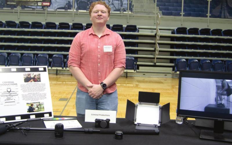 Seventeen local high school students competed in the eighth annual Cherokee County Youth Entrepreneur Fair at Galena High School on March 3. After some close competition, Derek Larison (above) won first place with his company Larison Lawn Care. Second place (below) went to Hayden Endicott with his video production company Criminal Productions. Photos by Jacob Spencer