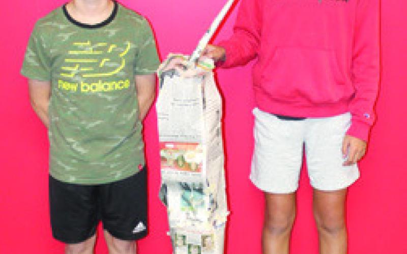 Students in Nicholas Weber’s seventh grade science class used the metric system to build scale models of the North Tower in commemoration of the 911 anniversary. The models were built using newspaper and tape with the requirement that it had to stand alone when completed. Dawson Beaty and Cole Howard tried their hand at tower making.