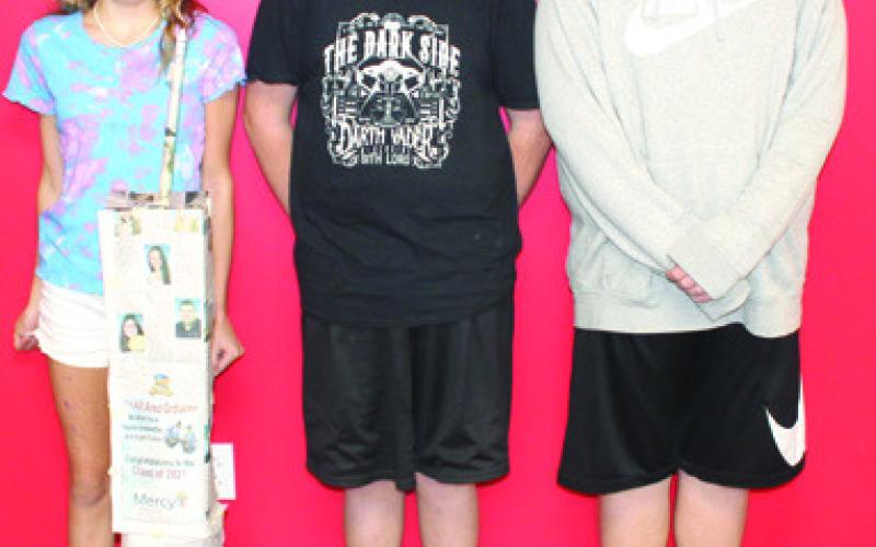 Students in Nicholas Weber’s seventh grade science class used the metric system to build scale models of the North Tower in commemoration of the 911 anniversary. The models were built using newspaper and tape with the requirement that it had to stand alone when completed. Reese Carter, Cullen Smith, and Brixton McElhany were among those creating towers.