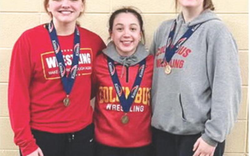Lady Titans Emily Britt, senior; Hannah Noel, sophomore, and Adalynn Hutto, freshman placed third, fifth, and fourth in the Kansas Class 4A Girls Wrestling Tournament, Saturday, in Salina. Columbus placed ninth out of 54 teams at the tournament. Courtesy photo.