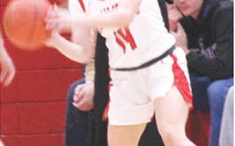 Lady Titan Junior, Bentley Townsend, looks to pass out to her teammate in Friday’s homecoming loss to St. Mary’s-Colgan, 15-72. Bentley had ten points in Friday’s loss and six in the win at St. Paul, Thursday.
