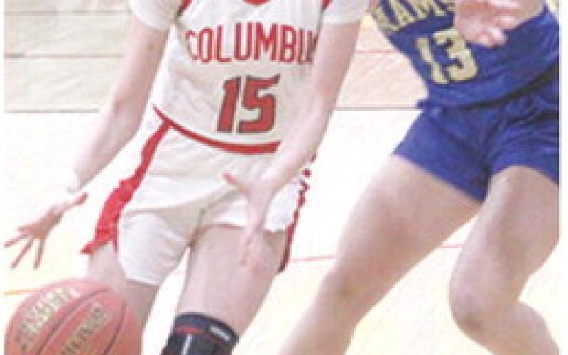 Lady Titan Sophomore, Natalie Wary, gets past her Riverton opponent in the February 4 loss to the Lady Rams. Columbus lost on the road at St. Mary’s-Colgan, Friday, 27-63.