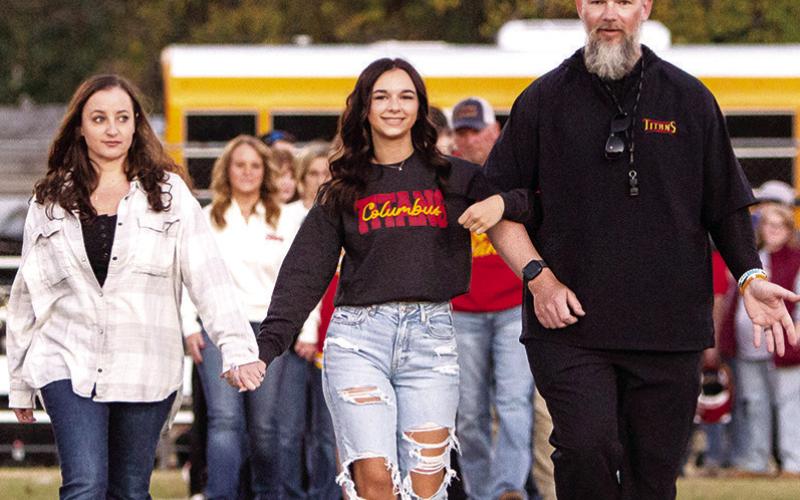Lady Titan Senior, Allison Burns, was recognized on Senior Night, Friday, at Titan Stadium, prior to the 28-21, Columbus win over Parsons. Allison has been the Titan Football Manager for four years. She was escorted by her parents, Amanda and Blake Burns.