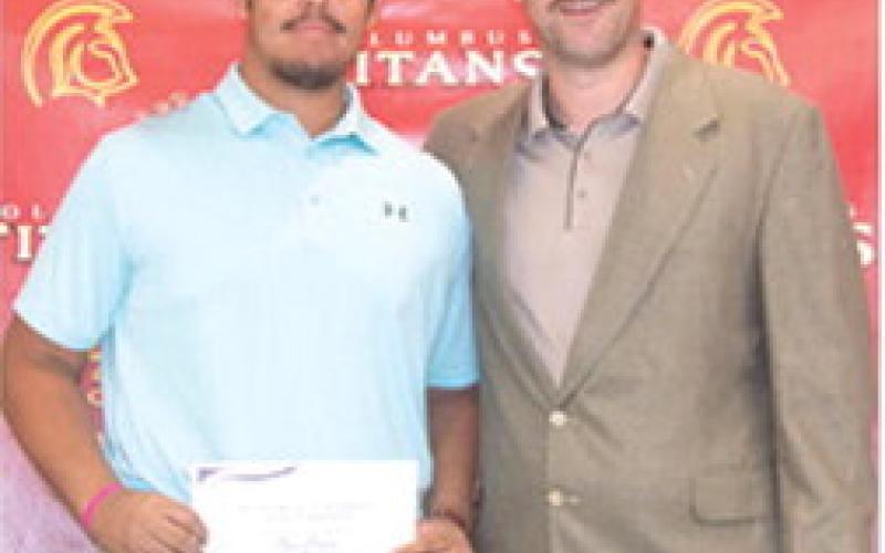 Rece Ponce received a Football Scholarship from Butler Community College in the amount of $12,000 during the Columbus Unified High School Senior Assembly, May 16, at the CUHS Gymnasium. The scholarship was presented by USD 493 Instructor, Matt Crain.