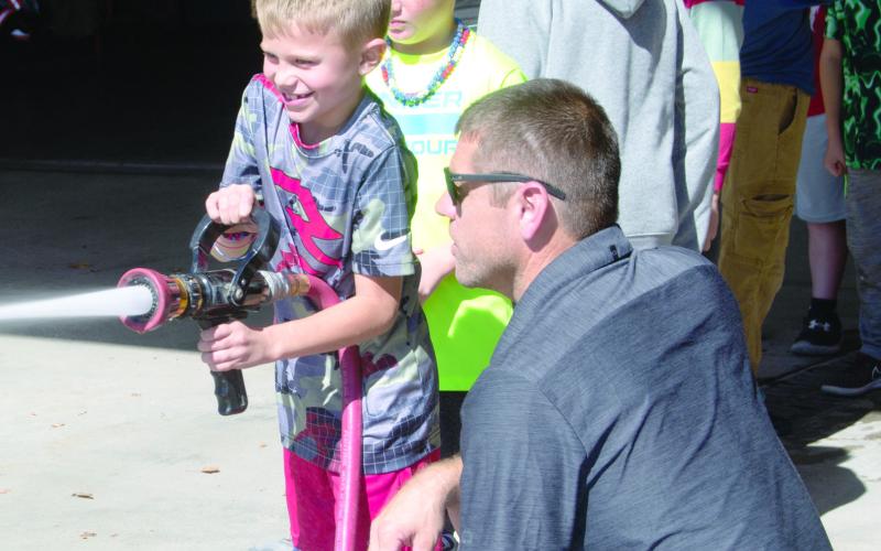 Lessons in operating a fire hose by firefighter Cody Burton