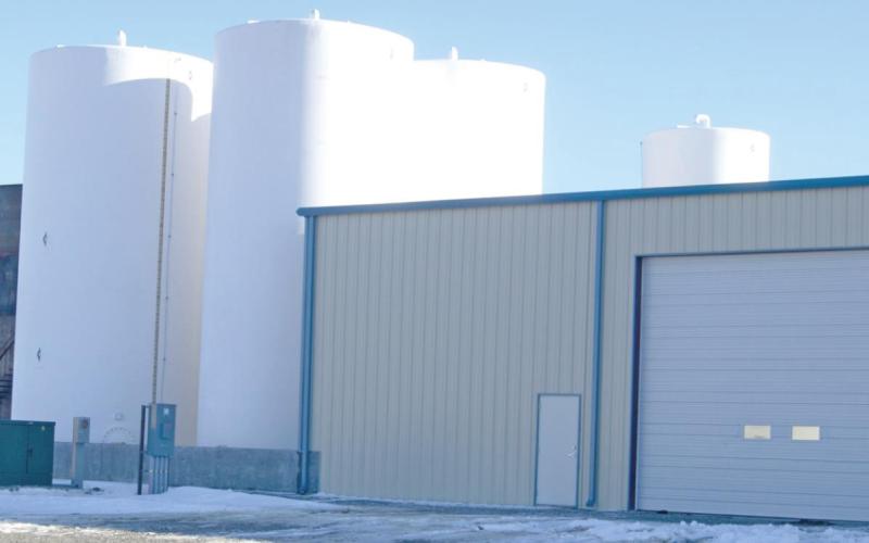 The Columbus branch of Farmers Coop is currently underway in a construction project south of the city. A liquid fertilizer facility complete with a UAN fertilizer tank, thiosulfate containers and a shipping and receiving facility are pictured. Photo by Jacob Spencer