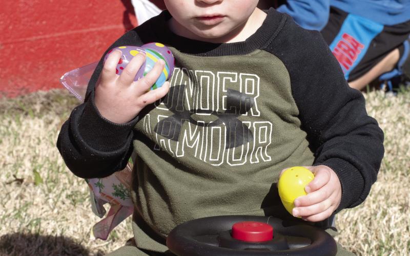Winner in the youngest age division of the Chamber of Commerce Easter Egg Hunt was James Fields. He was trying out his prize.z-