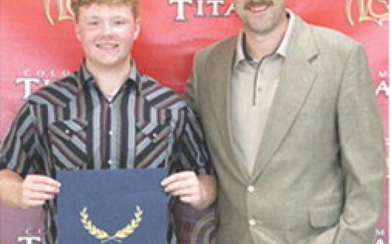 Kanyen Smith received the Ellis Family, Rooted in Rural Skilled Trade Scholarship in the amount of $8,000 during the 2025 Senior Assembly at the Columbus Unified High School Gymnasium, May 16. Matt Crain, USD 493 Administrator presented the scholarship.
